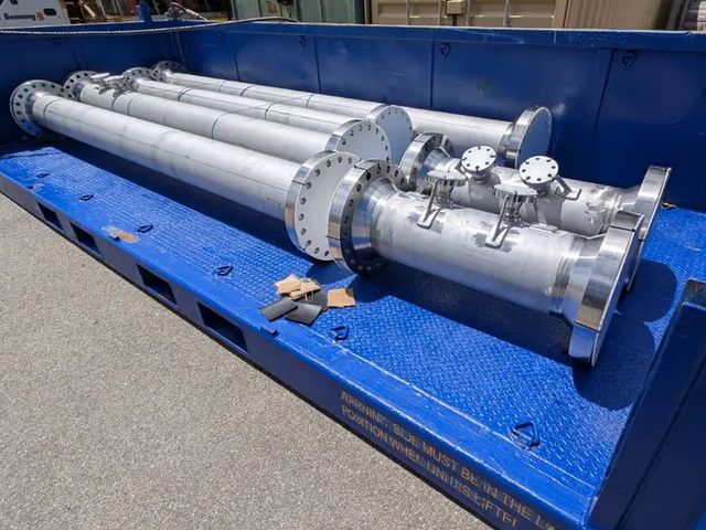 Fabricated pipe spools and valve assemblies in a transport frame